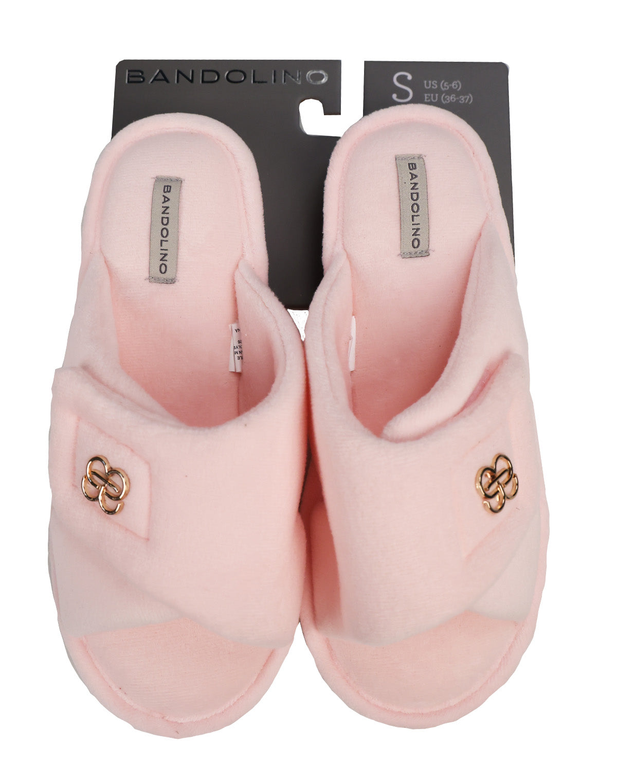 A pair of Bandolino pink plush slip-on slippers with gold-tone metal hardware, shown on their black size S retail card against a white background.