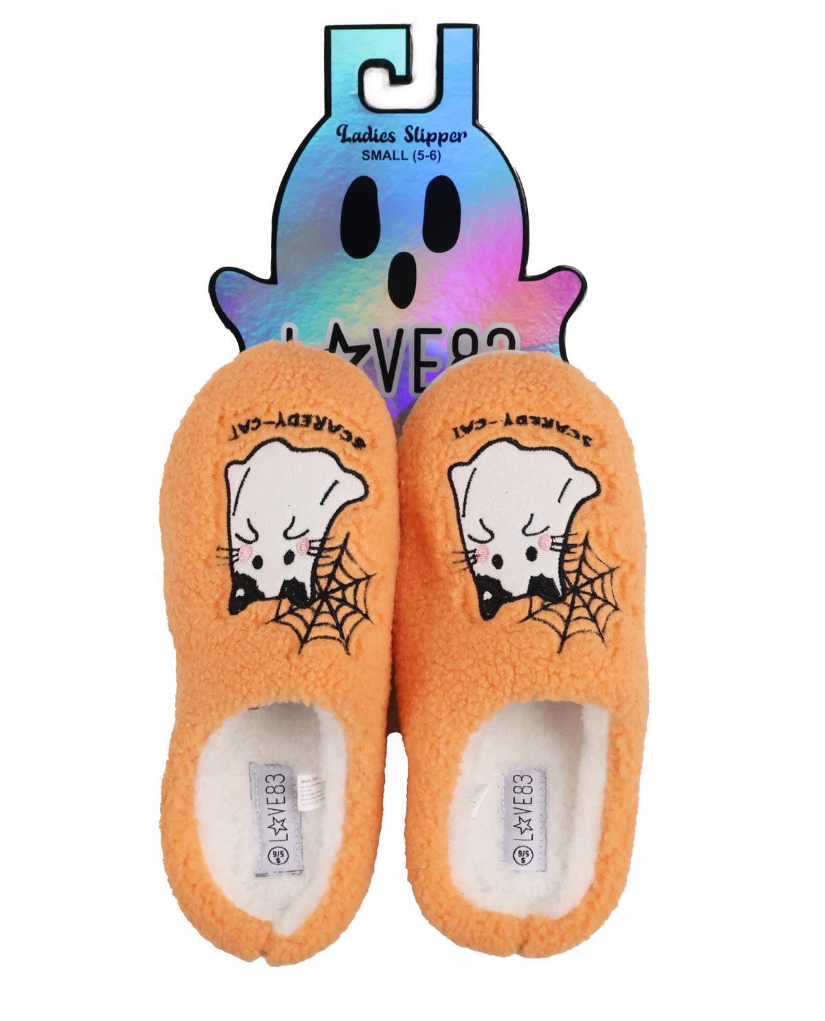 A pair of orange plush baby slipper socks with a cartoon ghost and spider design on the top, shown with their iridescent ghost-shaped retail hanger against a white background.