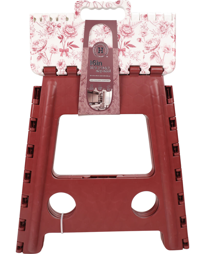 A red plastic step stool with a floral-patterned top panel and a hanging product tag, shown on a plain white background.