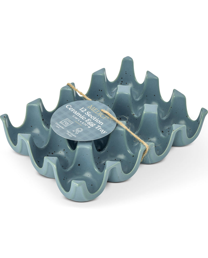 A 12-section ceramic egg tray set in a speckled slate blue-gray color, featuring a wavy, scalloped edge design. A round paper tag is tied to the set with twine.