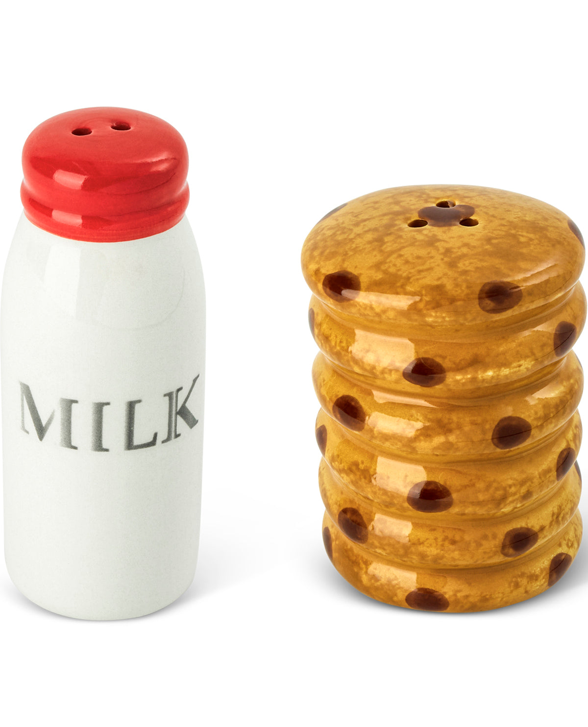 A ceramic milk bottle-shaped salt or pepper shaker with a red cap and the word 'MILK' printed on it, next to a stack of chocolate chip cookies shaped like salt shakers, on a white background.