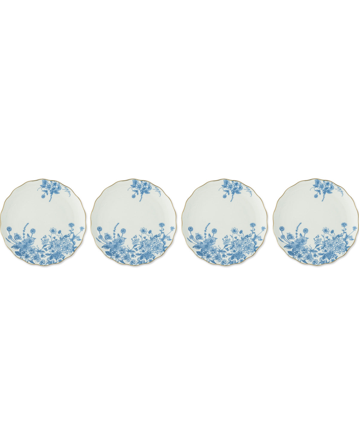 Four round white plates with scalloped edges, decorated with a blue floral pattern concentrated along the lower half, arranged in a row on a white background.