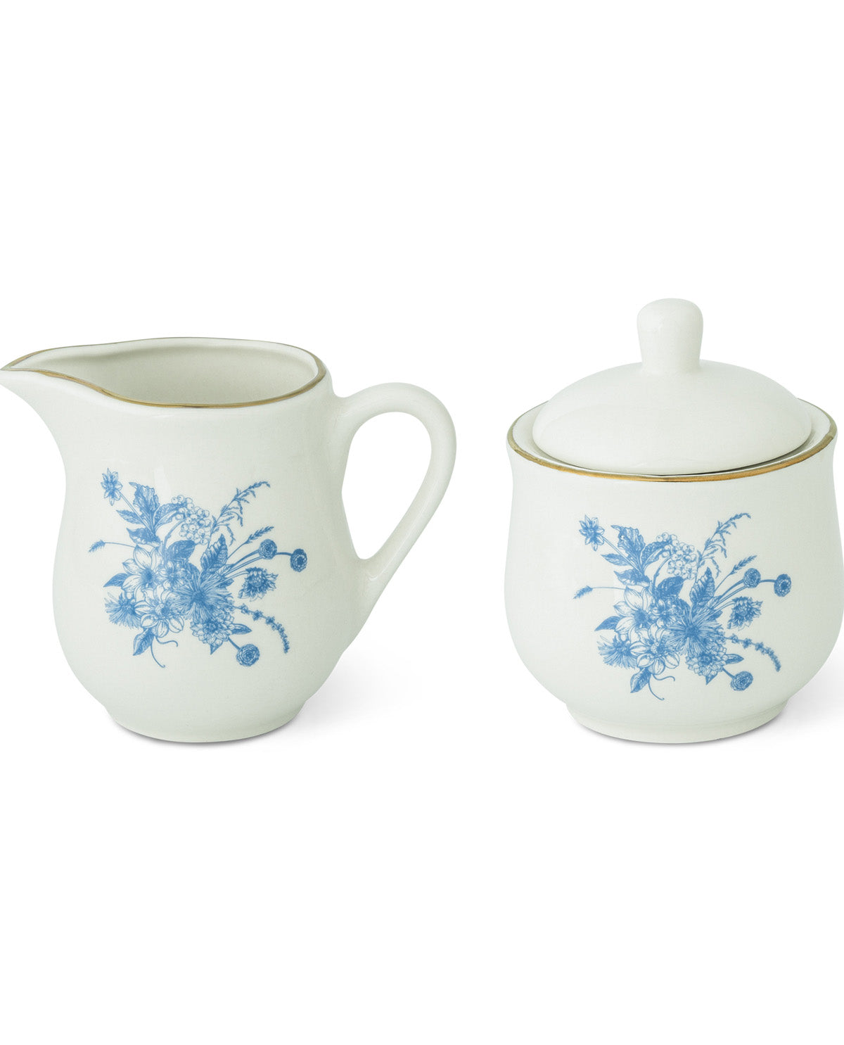 A white ceramic creamer pitcher and matching sugar bowl set with blue floral patterns and gold trim, shown on a plain white background.