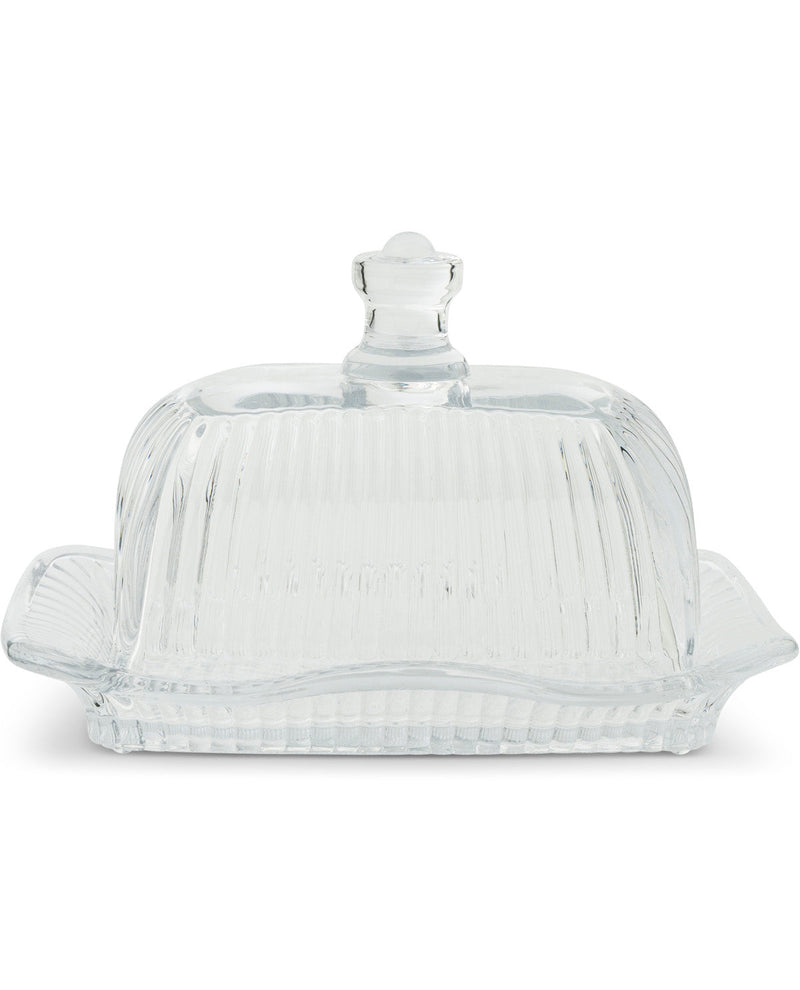 Clear ribbed glass butter dish with a matching lid and side handles, photographed on a white background.