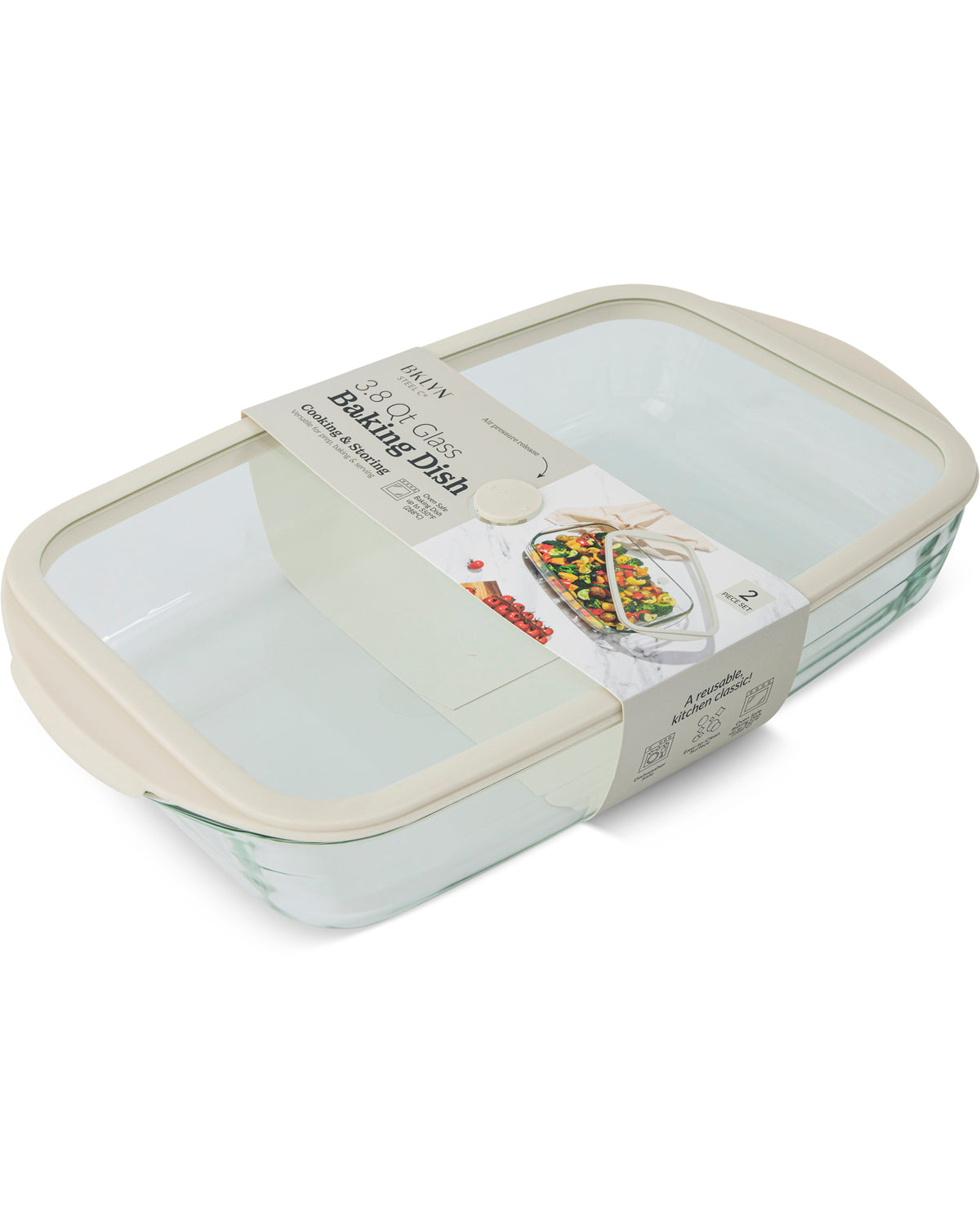 A rectangular glass baking dish with a clear lid and cream-colored rim, wrapped in a paper band label that reads 'Melt Pyrex Baking Dish'.