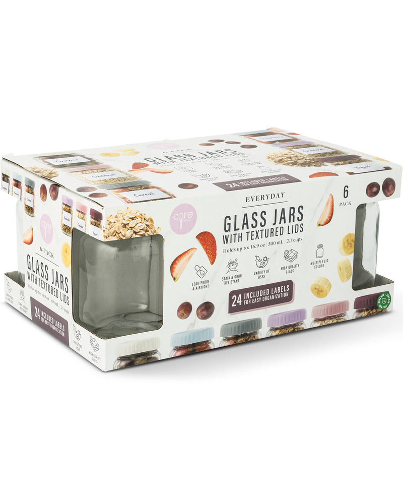 A boxed set of Everyday Glass Jars with Textured Lids, shown in its retail packaging on a clean white background. The packaging is white with illustrations of different jar lids in pastel and earthy tones, and clear windows reveal the glass jars inside.