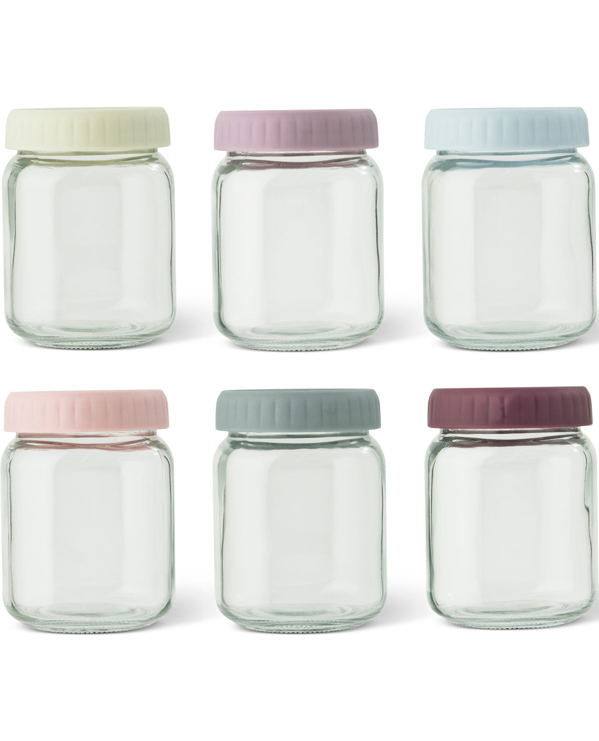 Six small clear glass jars arranged in two rows on a white background, each with a different pastel screw-top lid in cream, lavender, pale blue, blush pink, sage green, and mauve.