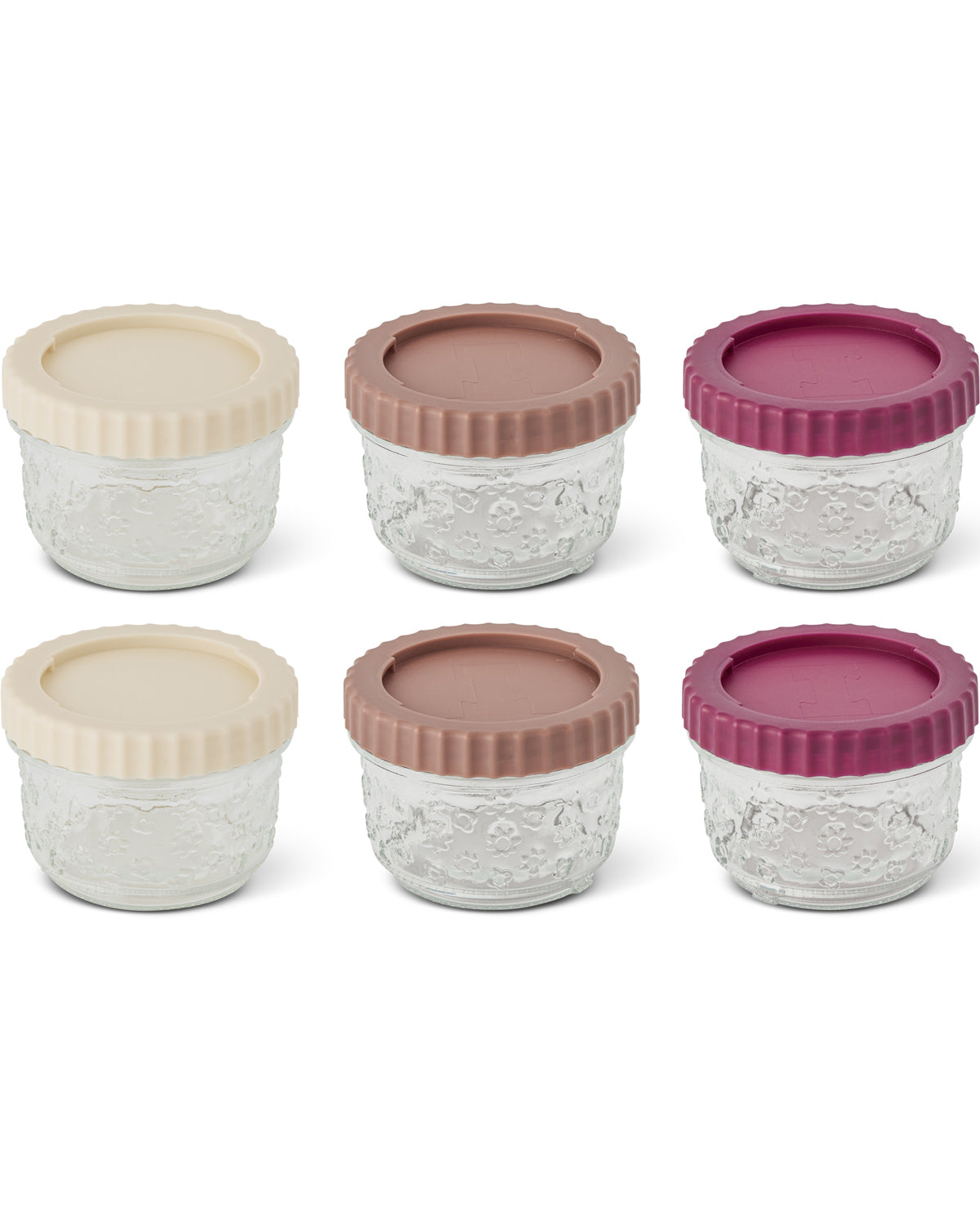 Six small clear glass storage jars with embossed floral patterns, arranged in two rows of three on a white background. Each jar has a different screw-top lid in cream, mauve, and taupe.