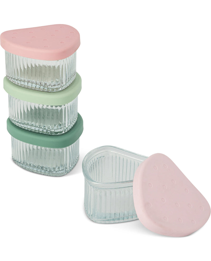 Three small ribbed clear plastic storage containers with pastel lids in pink, mint green, and sage green, shown on a white background with one container open and its lid placed beside it.