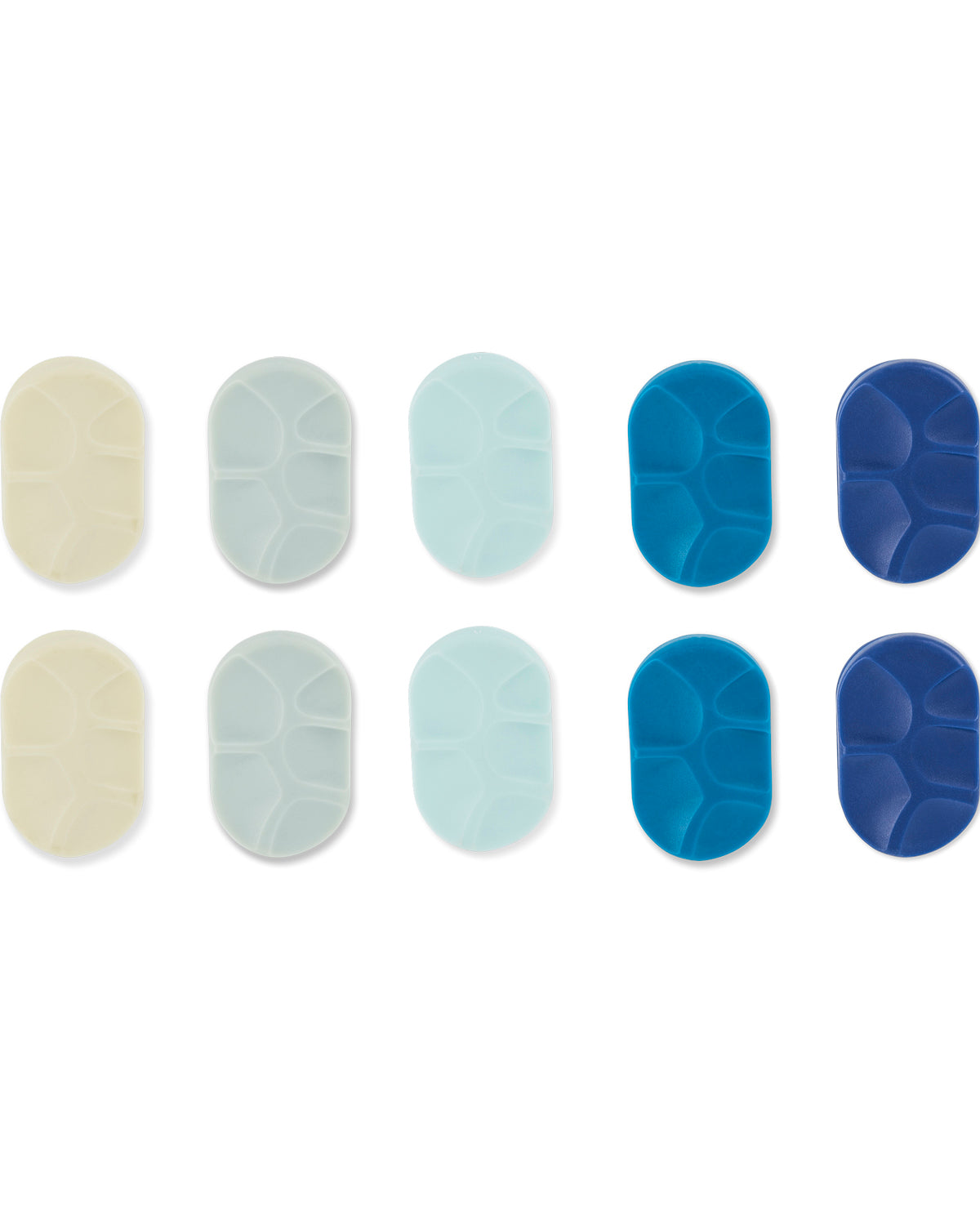 Twelve oval silicone or rubber grip pads arranged in two rows of six on a white background. The top row includes cream, pale gray, light blue, medium blue, and dark blue variants, while the bottom row shows matching pads with a textured, raised-seam pattern.