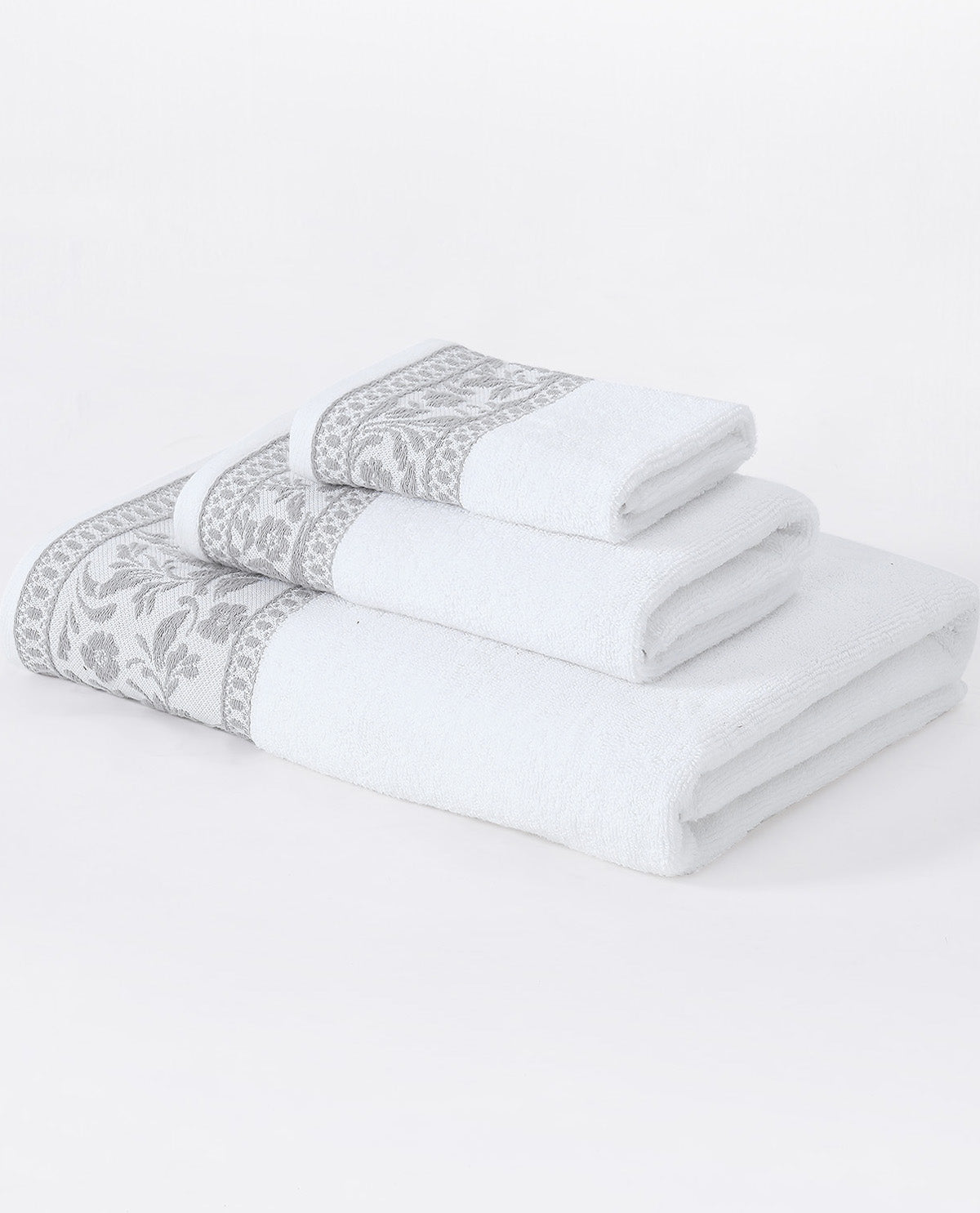 A set of three folded white bath towels with a gray damask pattern border, arranged by size on a seamless white background.