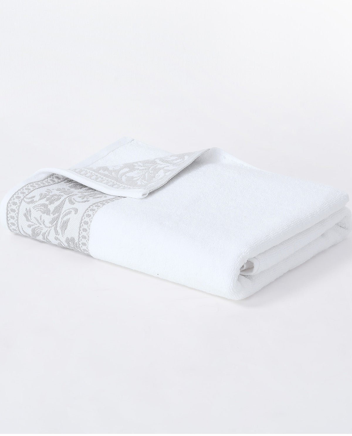A folded white bath towel with a decorative gray damask border, displayed on a clean white background.