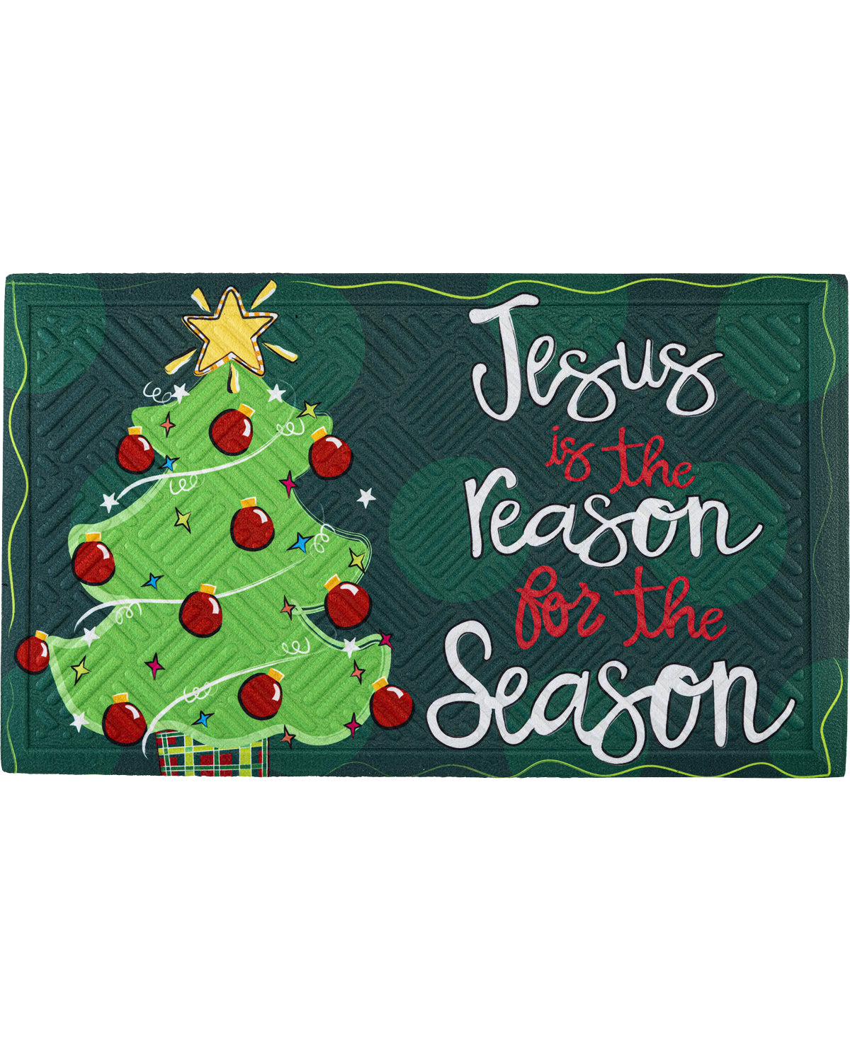 A rectangular Christmas-themed mat or sign with a dark green plaid background, a green Christmas tree with red ornaments and a gold star, and the phrase “Jesus is the Reason for the Season” in white and red script.