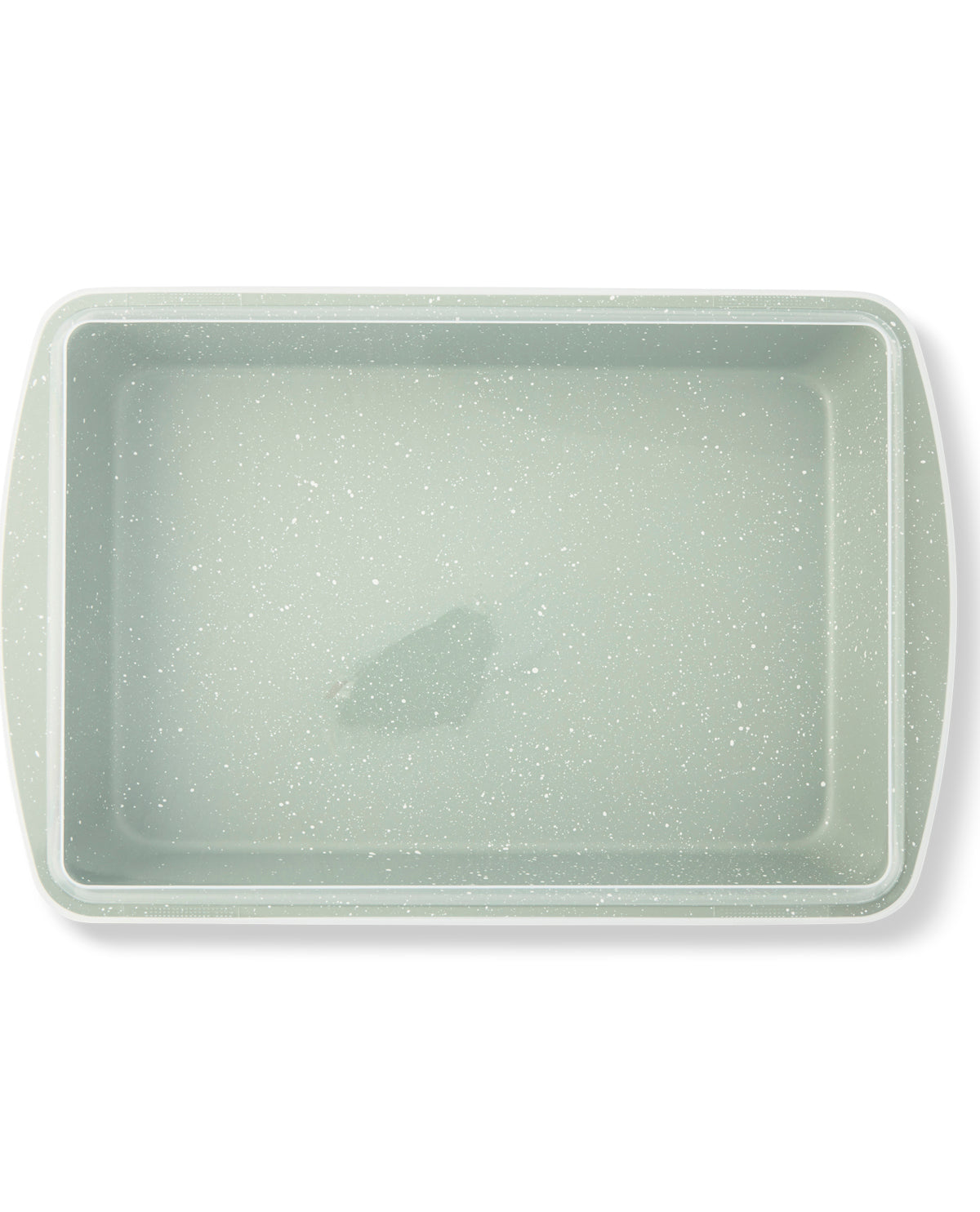 A rectangular baking pan with rounded corners and side handles, featuring a speckled sage green and white non-stick coating, shown from a top-down perspective on a white background.