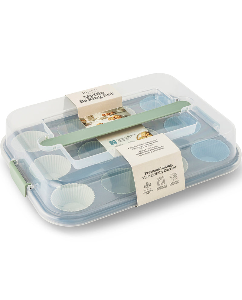 A 12-piece muffin tin set in a clear plastic storage container with a mint green handle and paper labels, photographed on a clean white background.