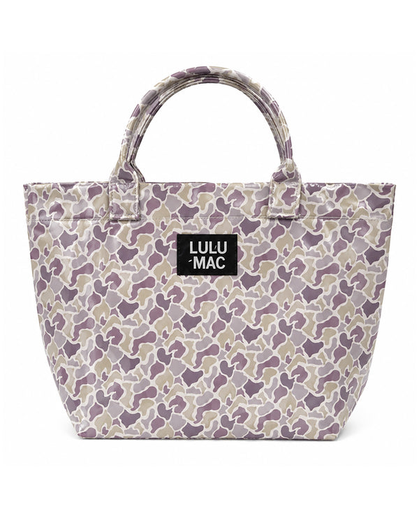 A Lulu Mac tote bag featuring a purple, beige, and gray camouflage pattern, with a black brand label on the front and dual top handles, set against a plain white background.