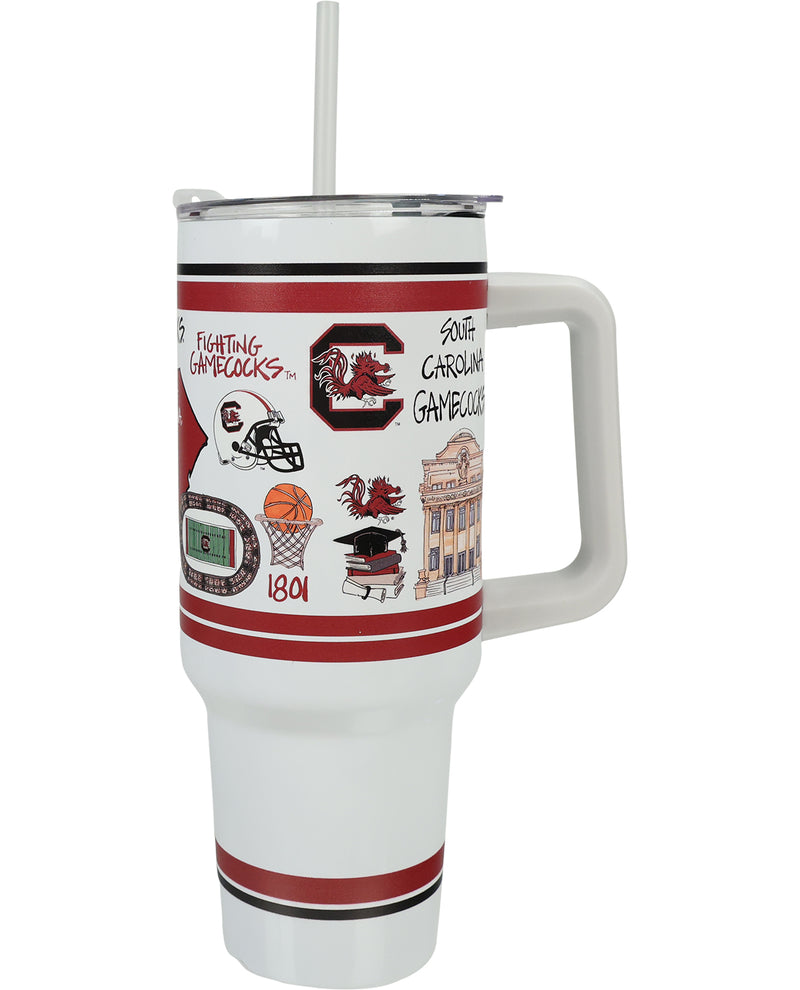 A white insulated travel tumbler with a handle and straw, featuring red and black stripes and a graphic collage of South Carolina Gamecocks-themed illustrations on the front.