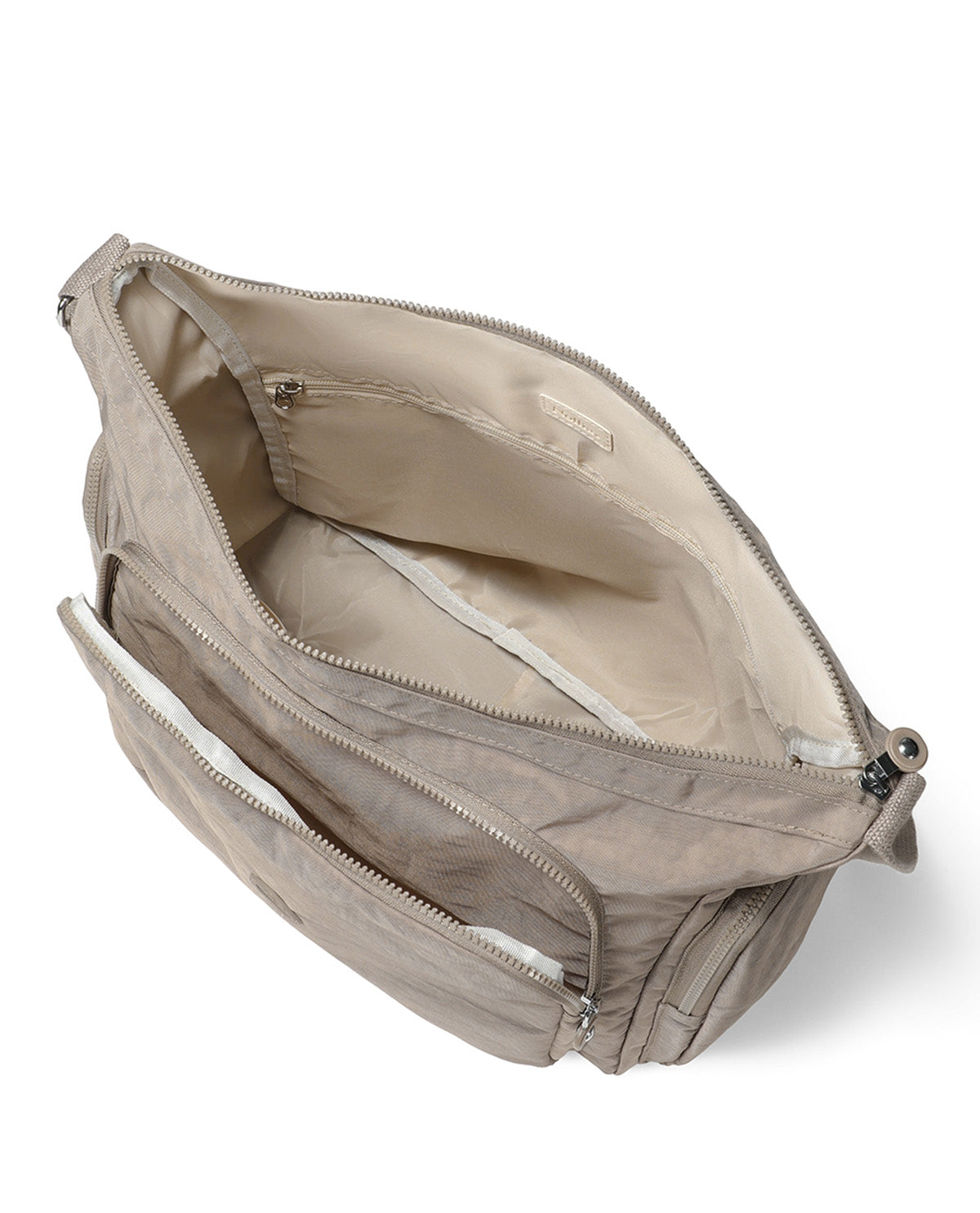 An open beige nylon crossbody bag with multiple zippered compartments, shown from an overhead angle on a white background.
