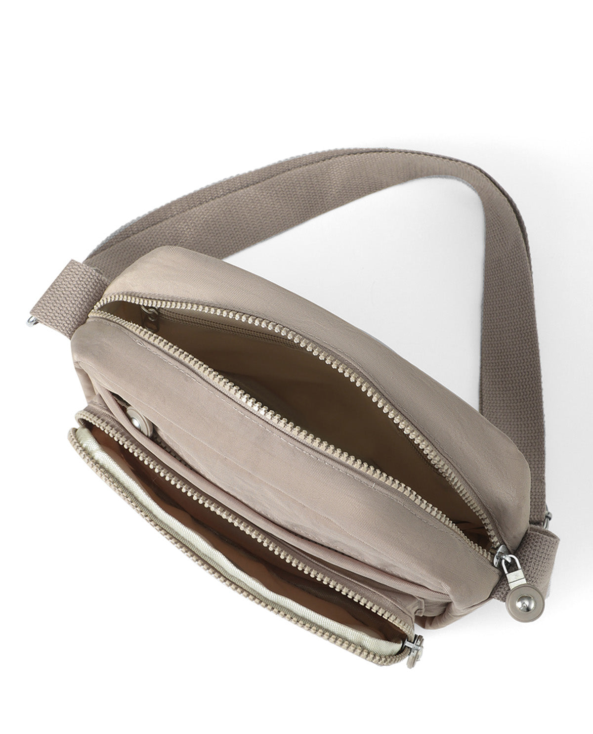 A taupe-gray nylon crossbody bag with a wide adjustable strap, shown open to reveal its interior compartments and silver-tone zippers, set against a plain white background.
