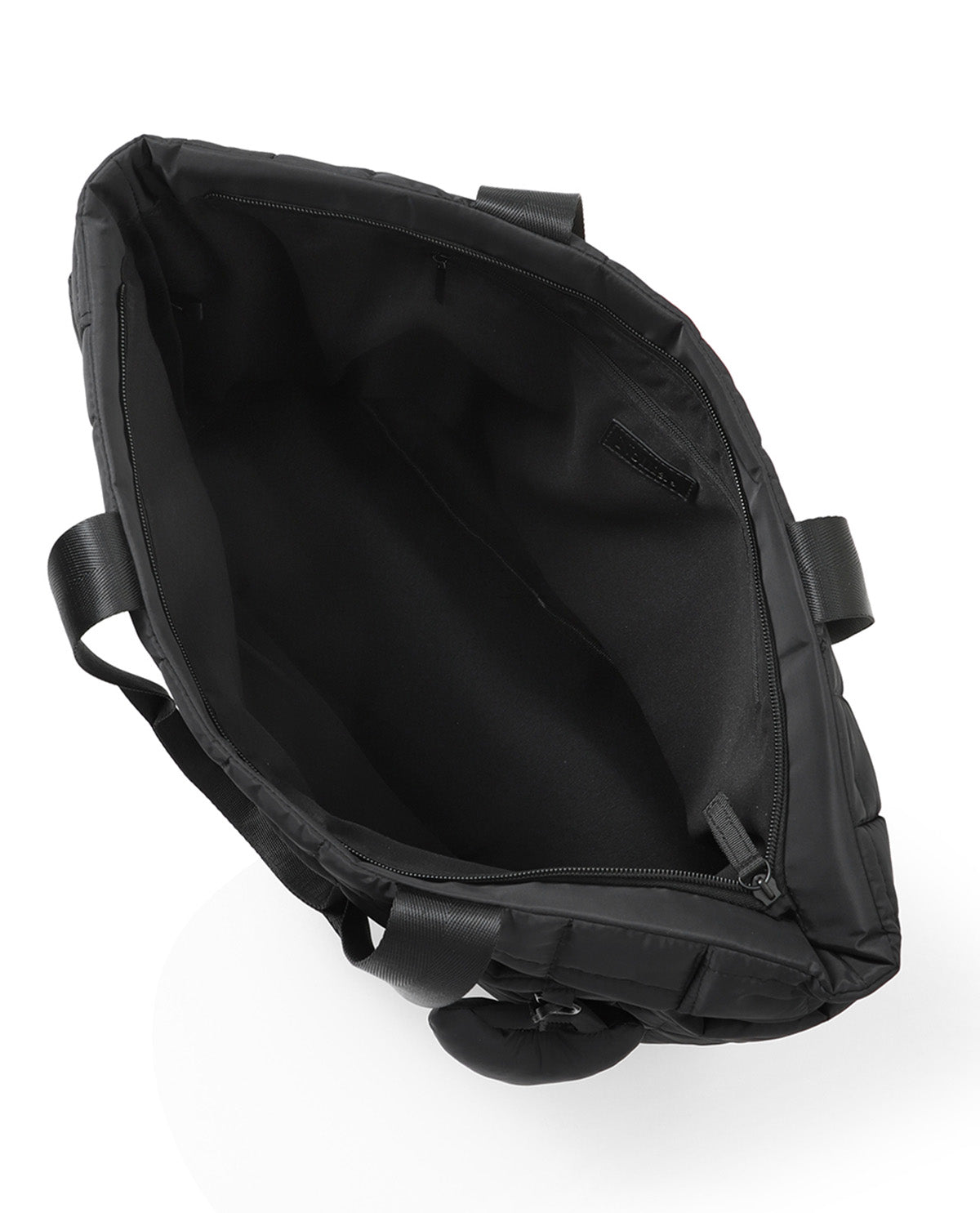 Black nylon shoulder bag shown from an overhead angle, highlighting its spacious interior, zippered compartments, and padded shoulder strap on a white background.