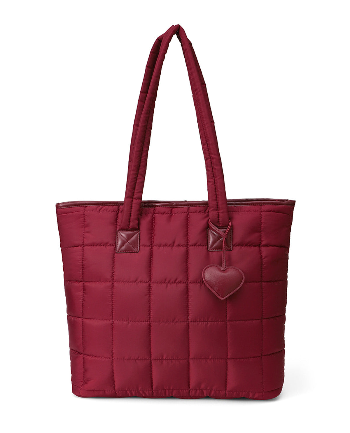A burgundy quilted nylon tote bag with double shoulder straps, brown leather-like accents on the strap attachments, and a hanging heart-shaped charm, shown against a plain white background.