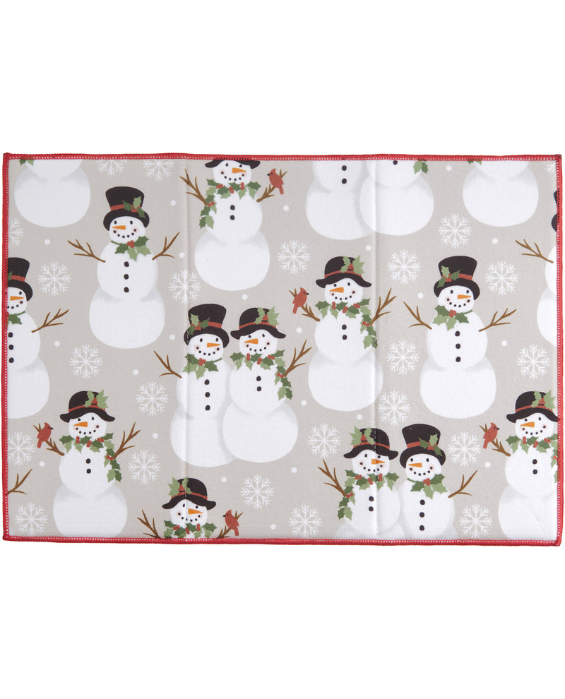 A rectangular fabric item, likely a scarf or bandana, featuring a repeating pattern of snowmen and snowflakes on a light gray background with a red border.