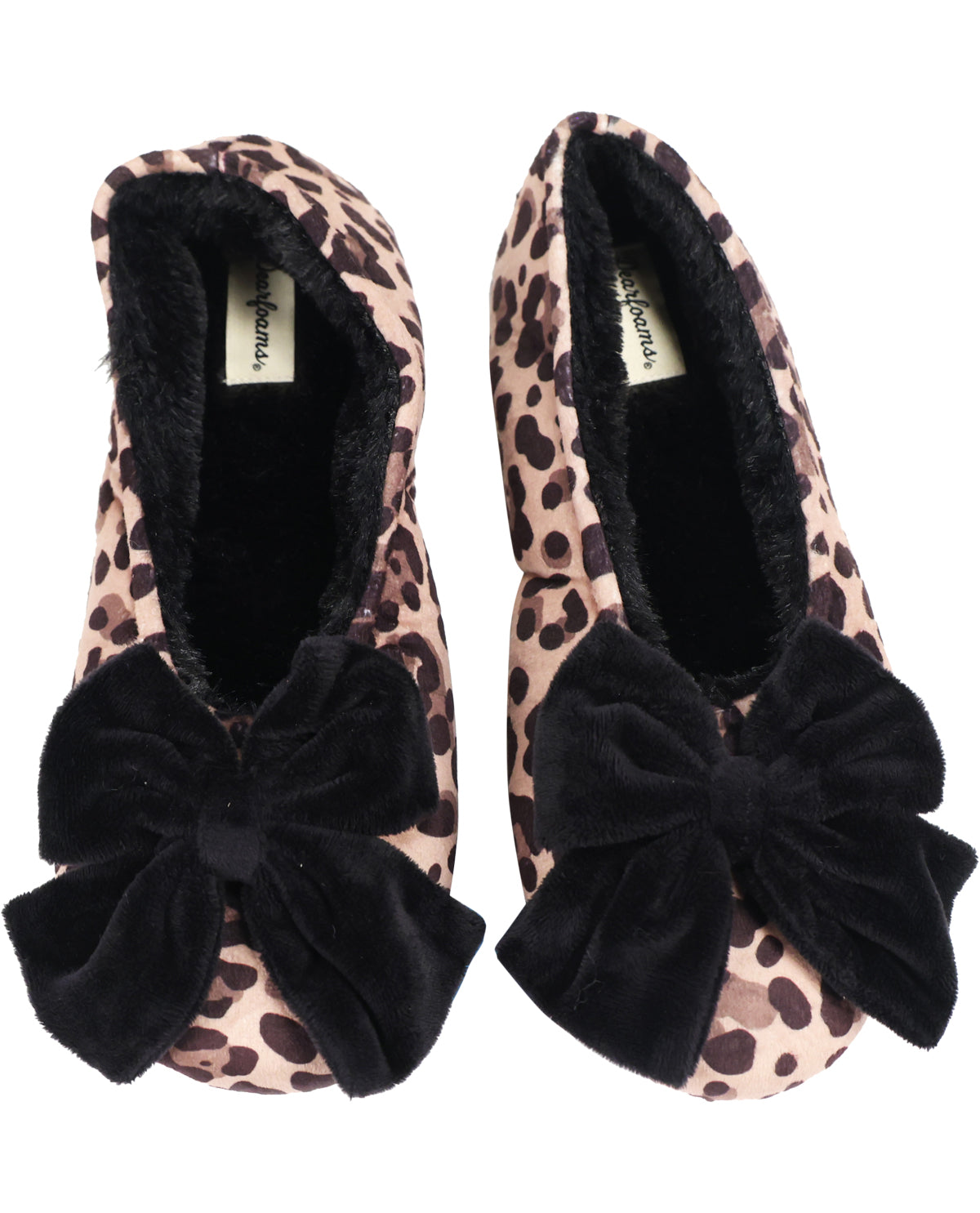 A pair of slip-on slippers with a beige and brown leopard print pattern, featuring a large black velvet bow on the front and a black plush faux-fur lining, shown against a plain white background.