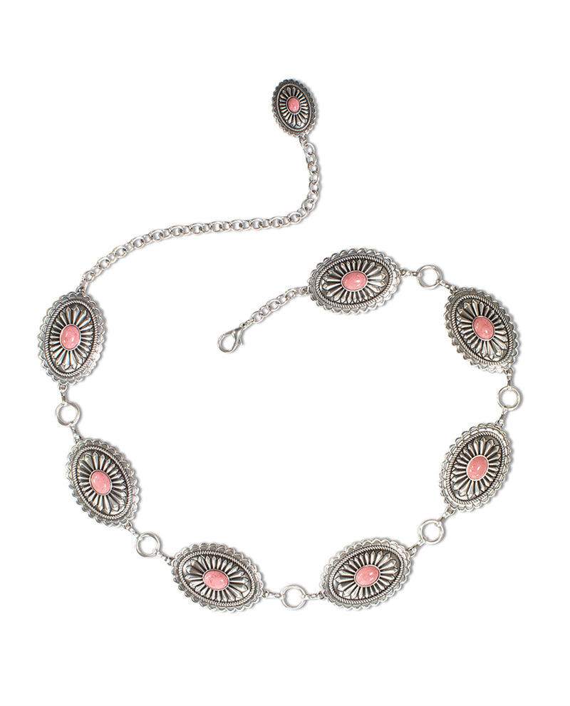 A silver-toned chain bracelet featuring seven oval concho-style motifs with pink and white inlay, displayed on a clean white background.