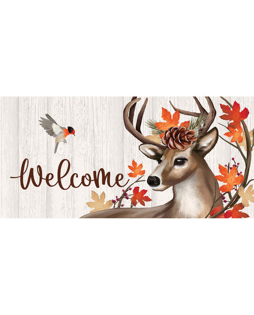 Decorative mat with a deer, leaves, and 'Welcome' text on a wooden background