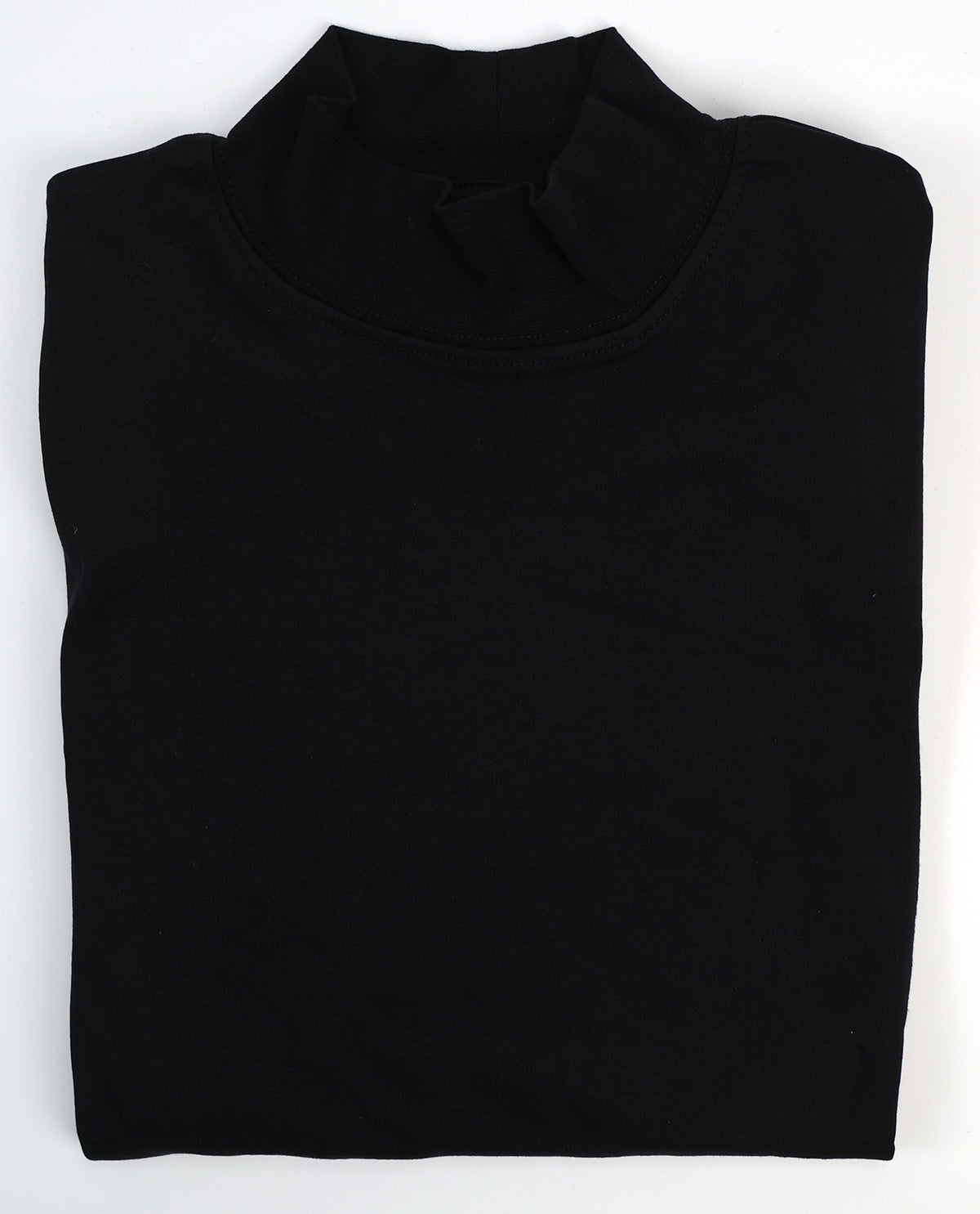 Folded black turtleneck sweater on a white background