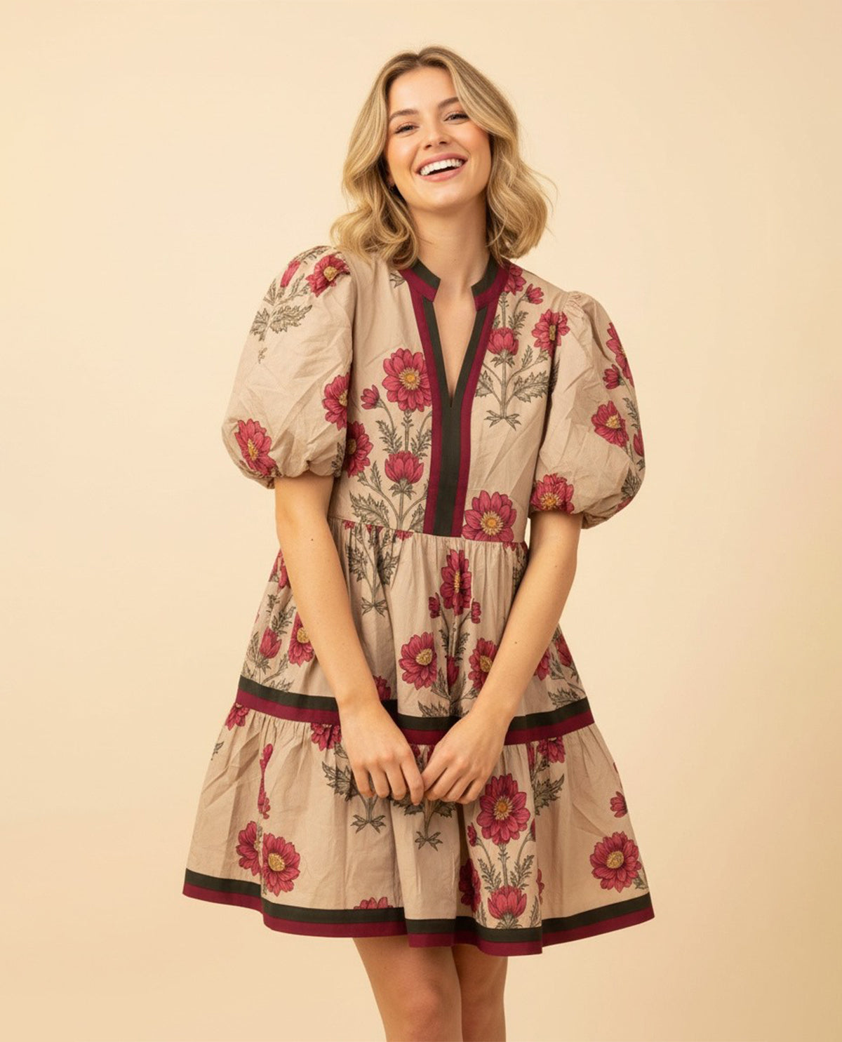 Woman wearing a floral dress on a beige background