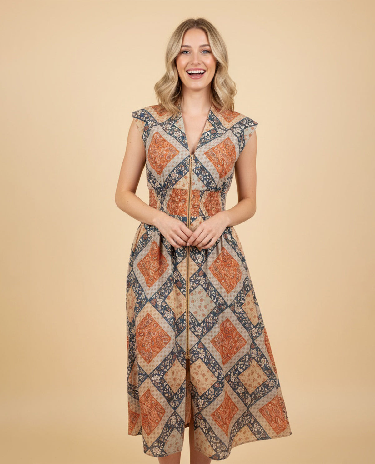 Woman wearing a patterned dress on a beige background