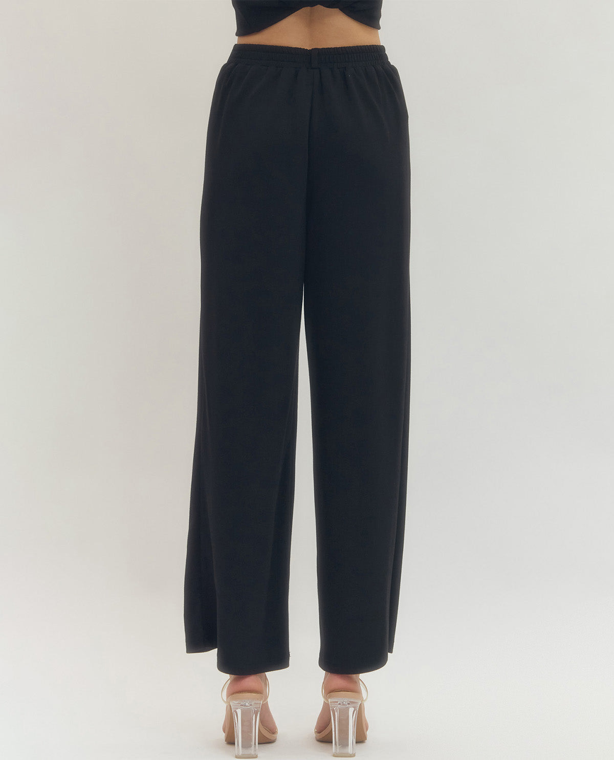 Black wide-leg pants on a white background