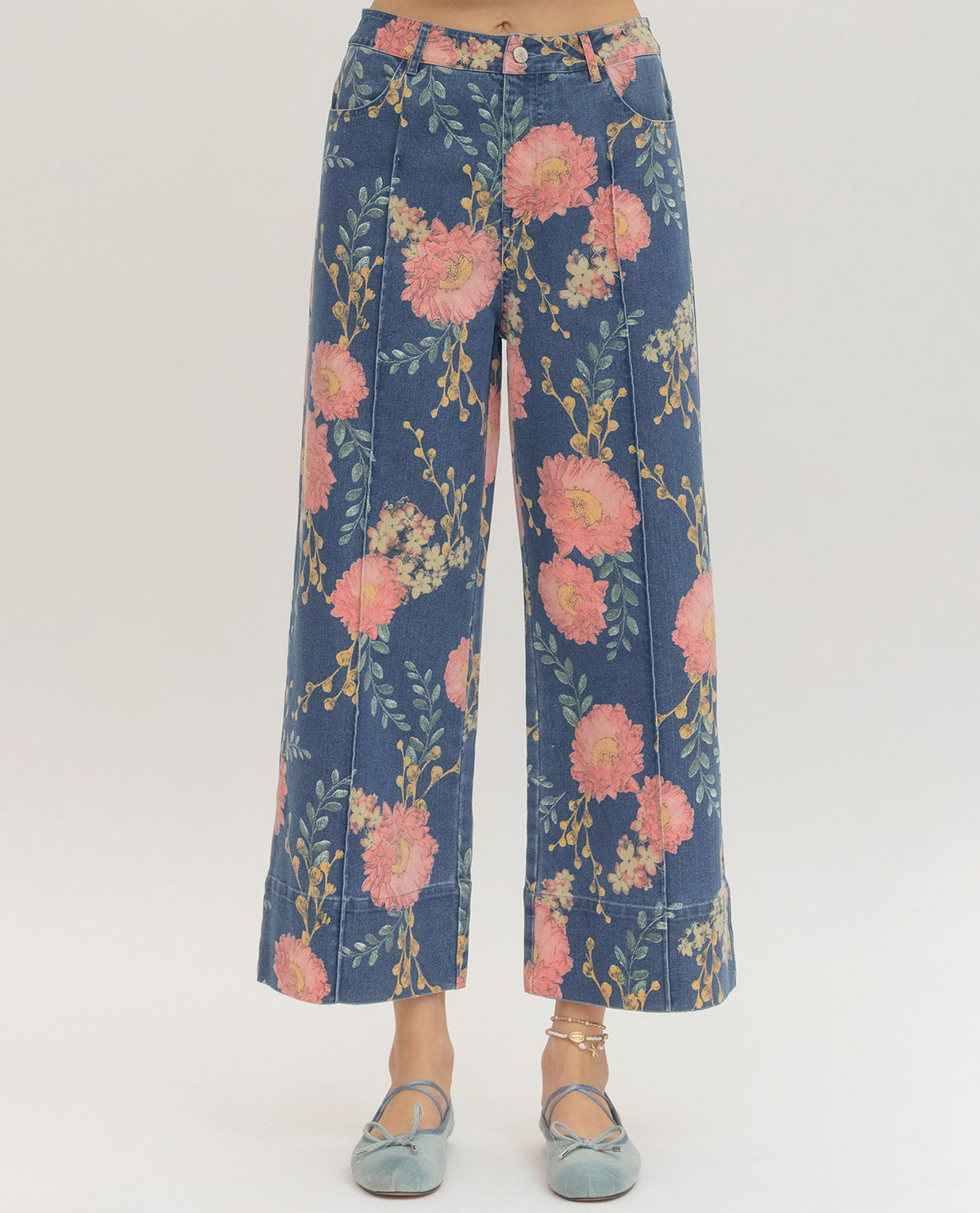 Blue floral-patterned pants on a white background