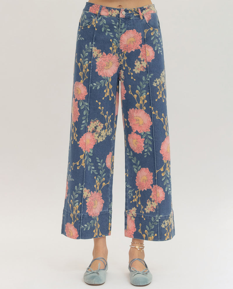 Blue floral-patterned pants on a white background
