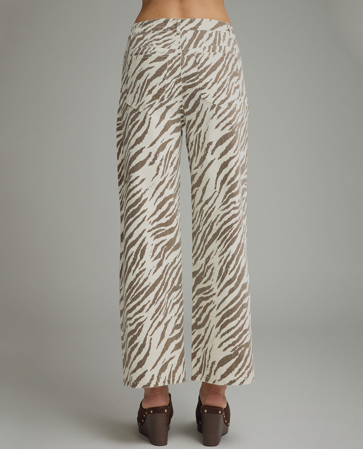 Zebra print pants on a plain background