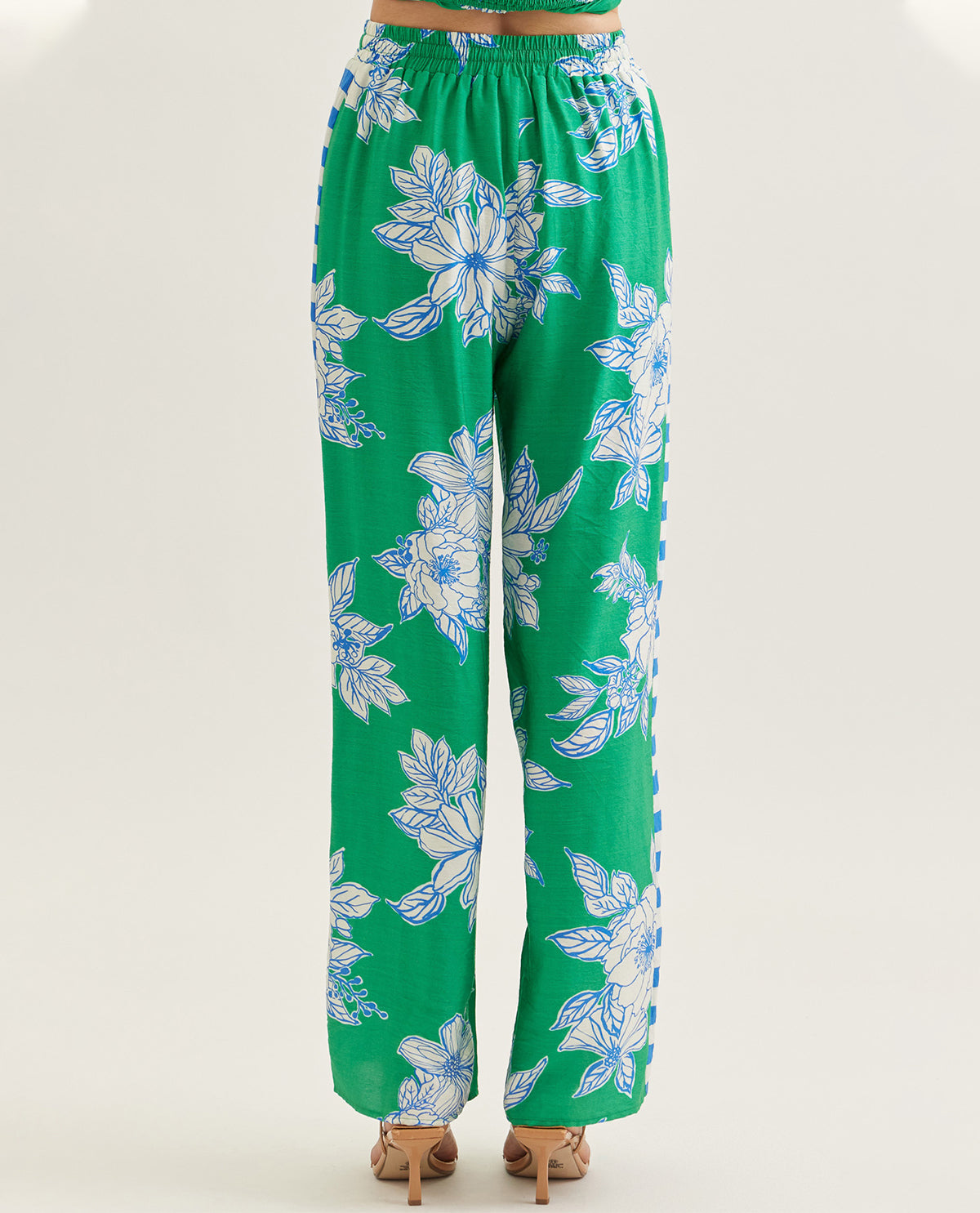 Green floral pants on a white background