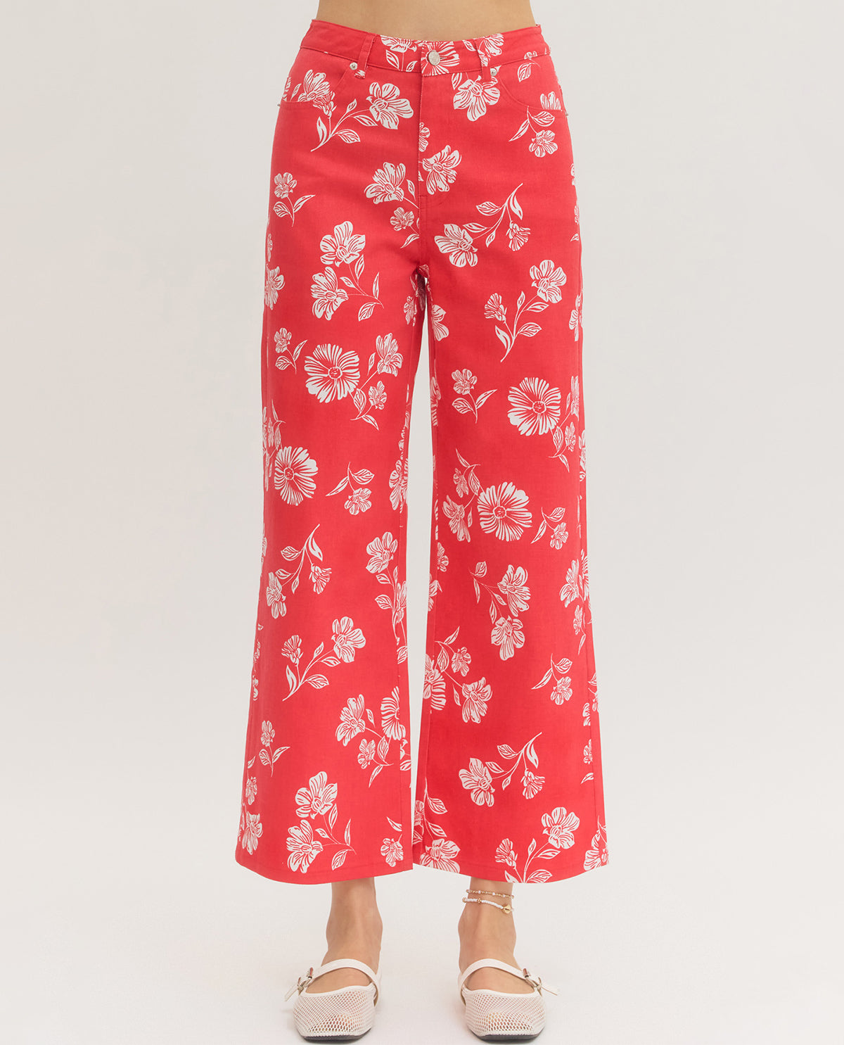 Red floral pants on a white background