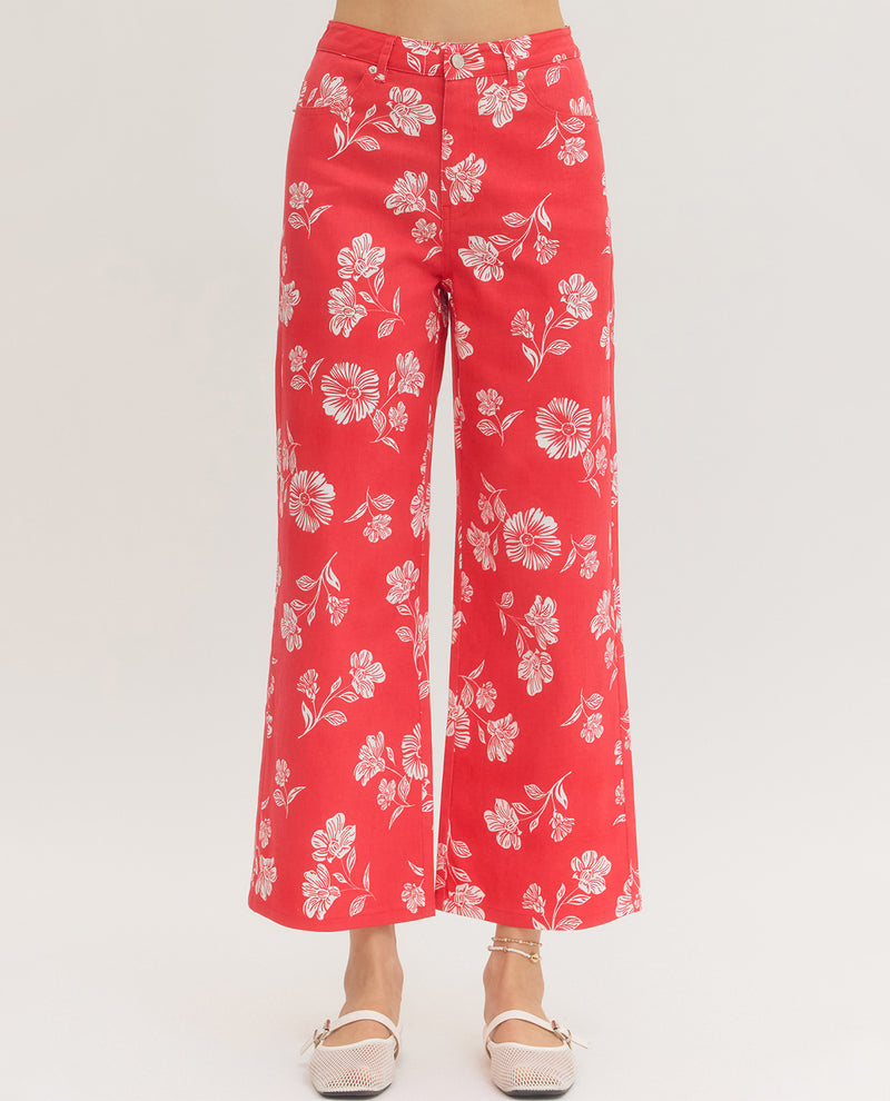 Red floral pants on a white background