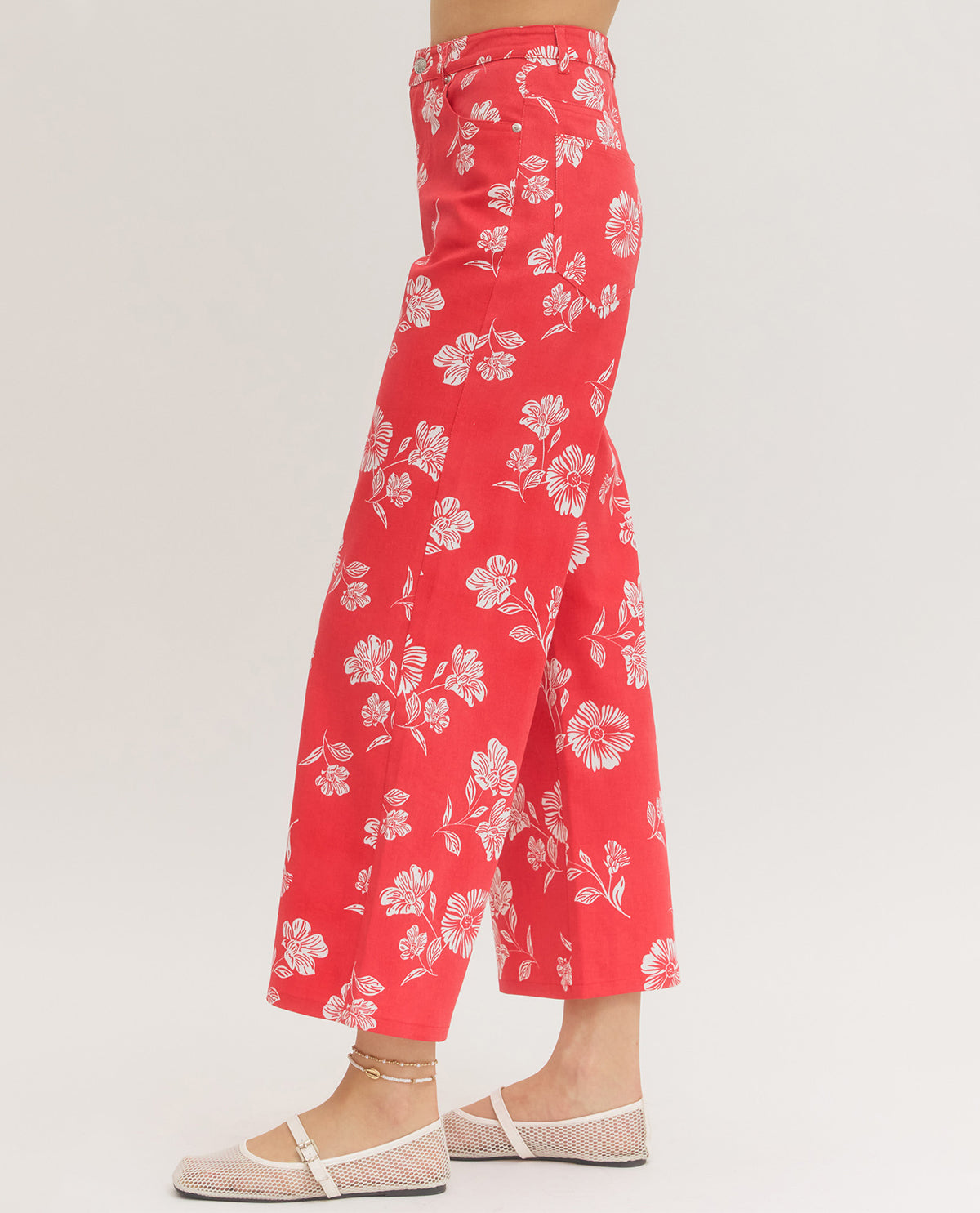 Red floral pants on a white background