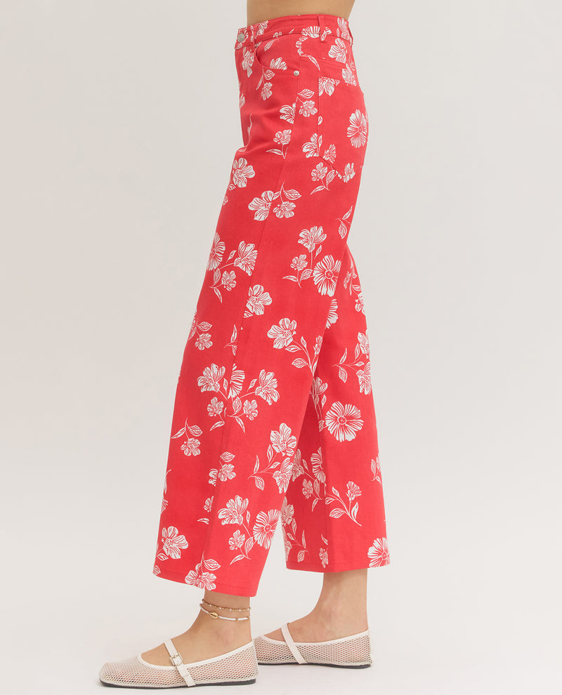 Red floral pants on a white background