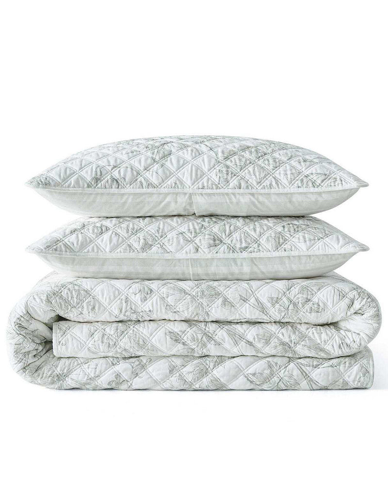 A stack of three light gray quilted bedding pieces, including two pillows and a folded comforter or quilt, shown on a plain white background.
