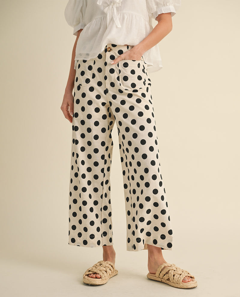 Missy model wearing straight fit cream color cropped polka dot pants