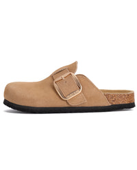 A tan suede clog shoe with a gold-tone buckle strap and a cork-textured footbed, shown from a side profile on a white background.