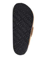 The black outsole of a slide sandal, featuring a repeating embossed pattern of the brand name 'PROJECT CLOUD'. The tan leather side of the shoe is partially visible on the right against a solid white background.