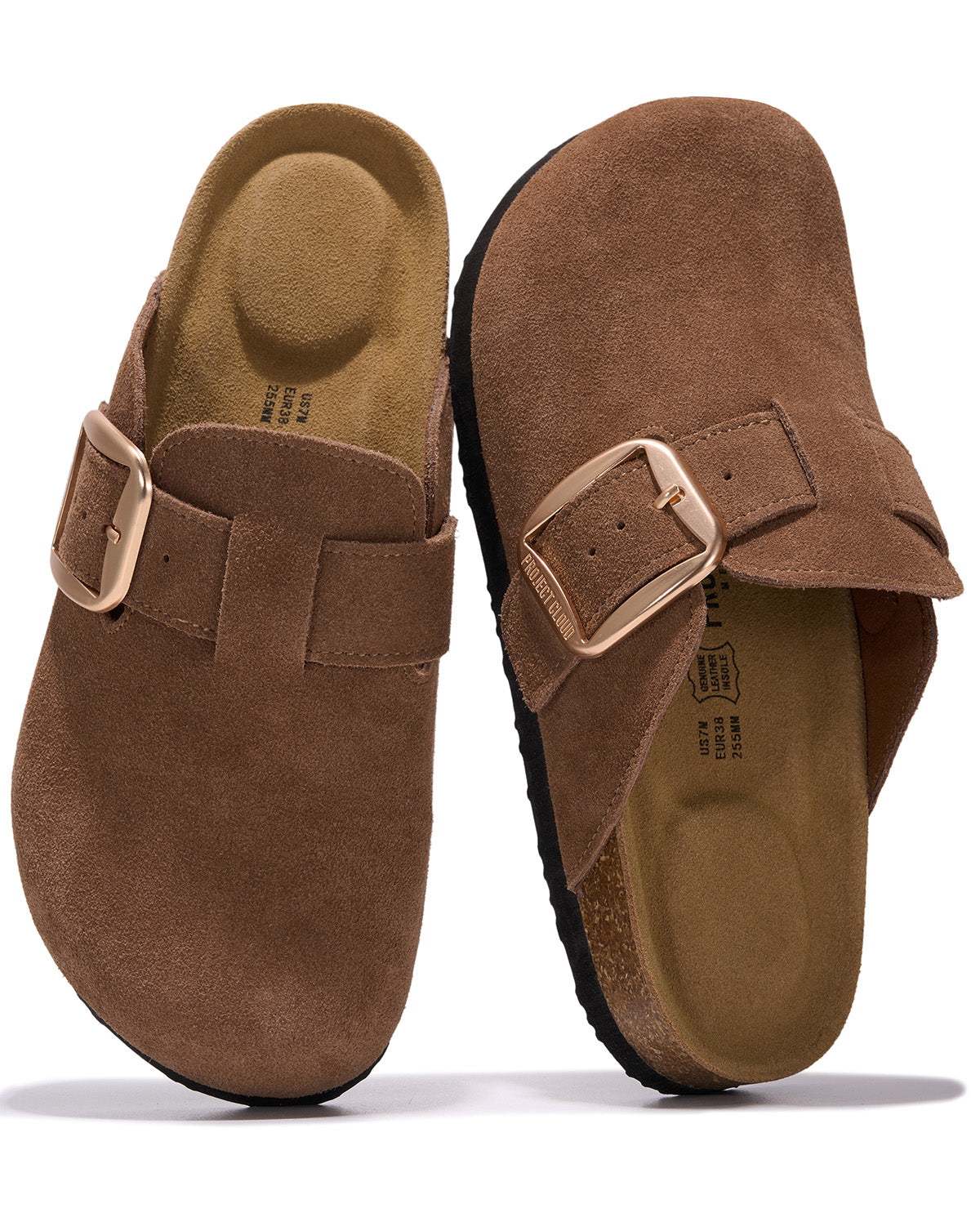 A pair of brown suede clogs with adjustable buckle straps, shown from the top and side views on a white background.