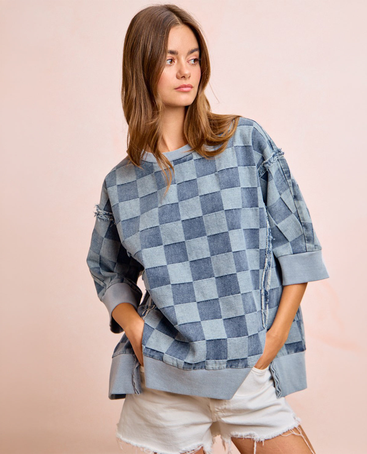Woman model wearing 3/4 sleeve checkered denim top