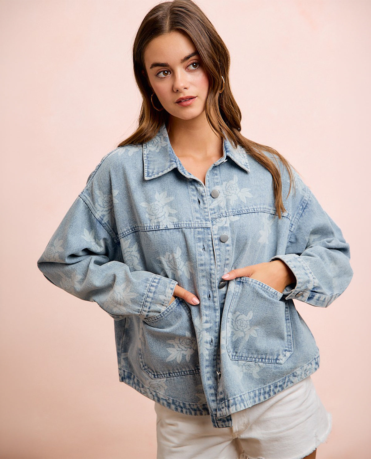 Woman model wearing long sleeve rose print denim jacket
