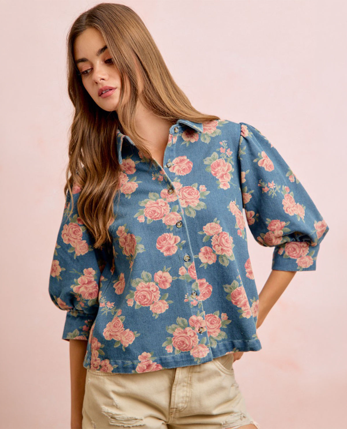 Woman model wearing 3/4 sleeve floral denim blouse

