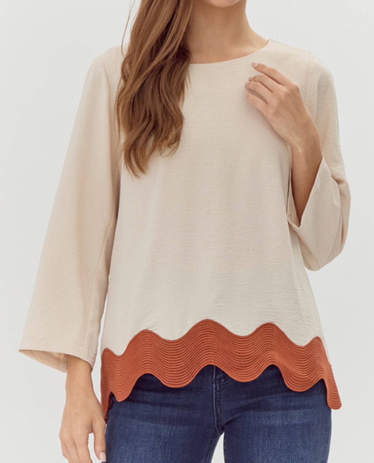 U-Neck Top with Ribbed Swirl Hemline